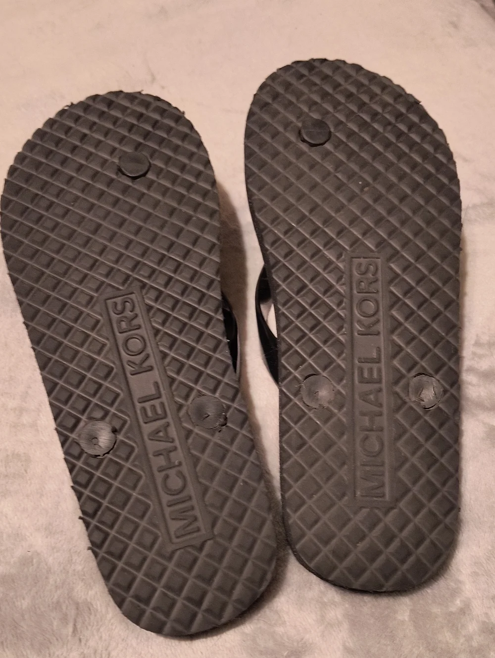 MK black flip flops size 7
